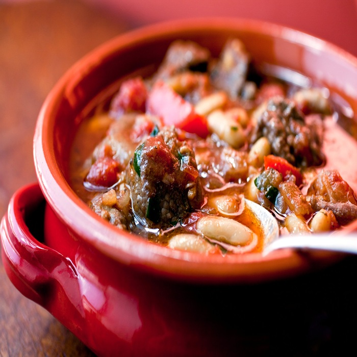 Spanish-style slow-cooked lamb shoulder and beans